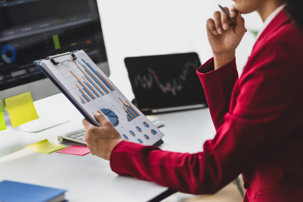 Business analyst reviewing data charts