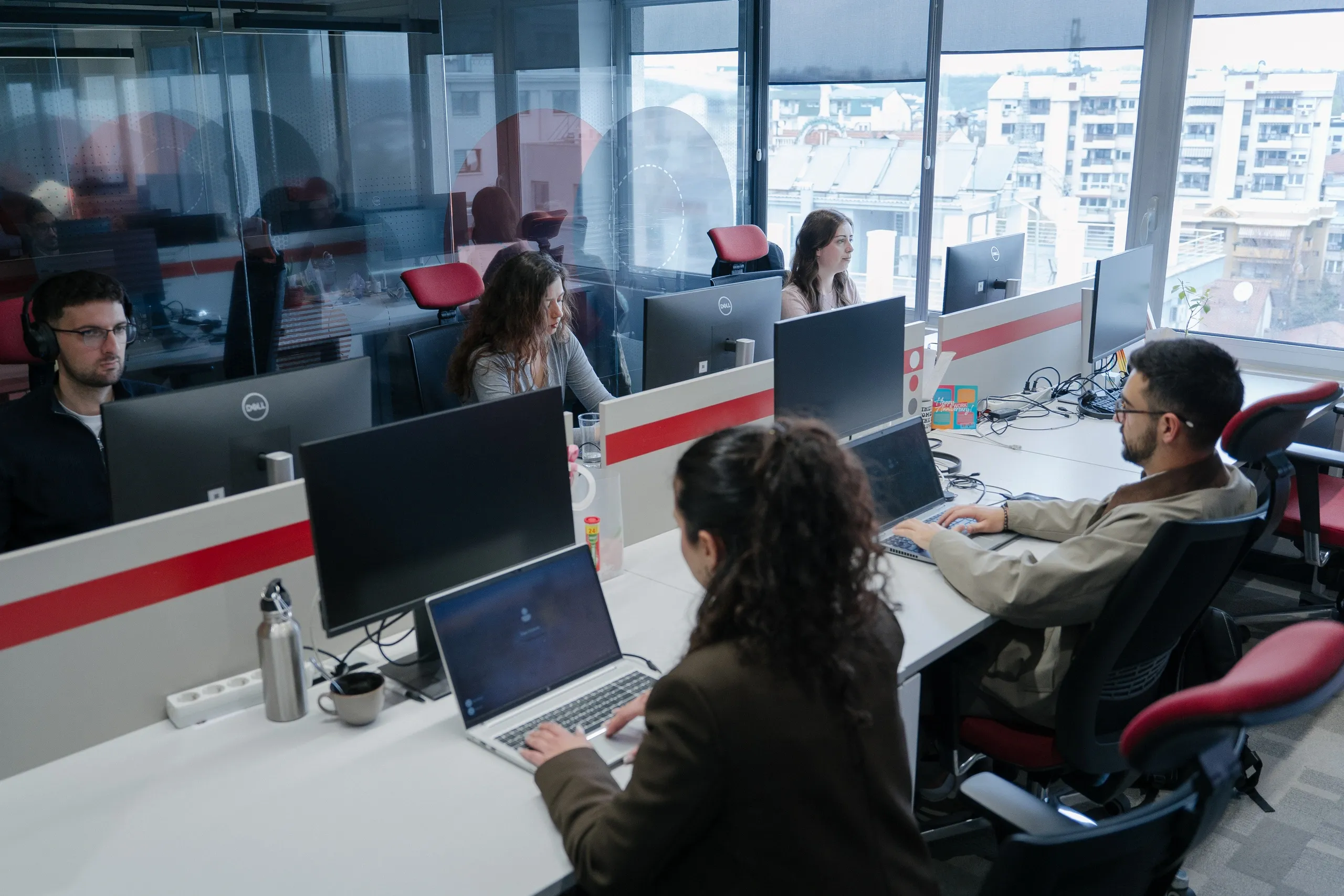 Real customer call center with IWFirstCall support agents on headsets